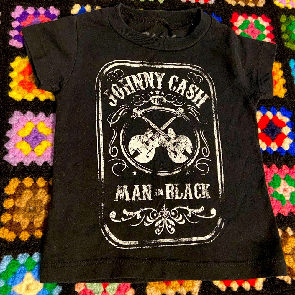 Man in black infant T-shirt